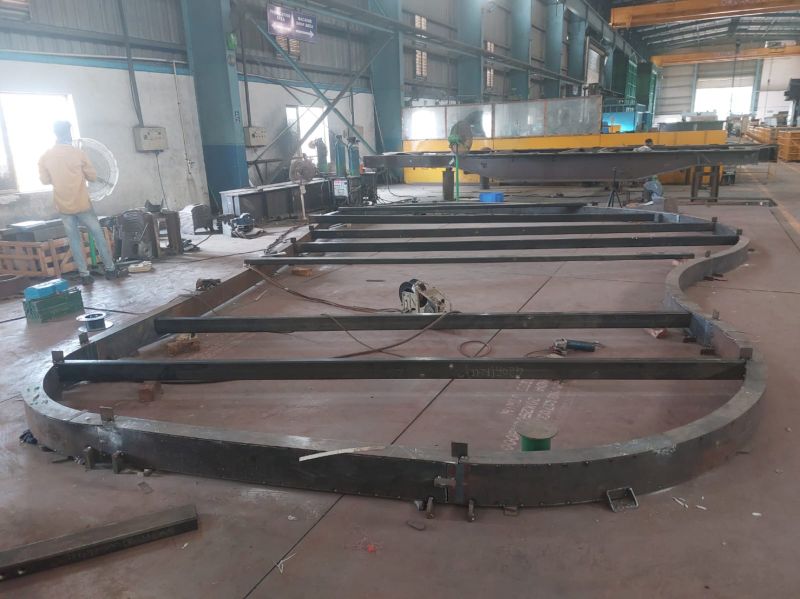 Curved steel facade frames under fabrication in a Glasspaane factory