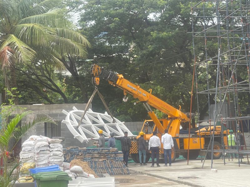 Steel skylight frame being lifted into position at the Gyanodaya Project