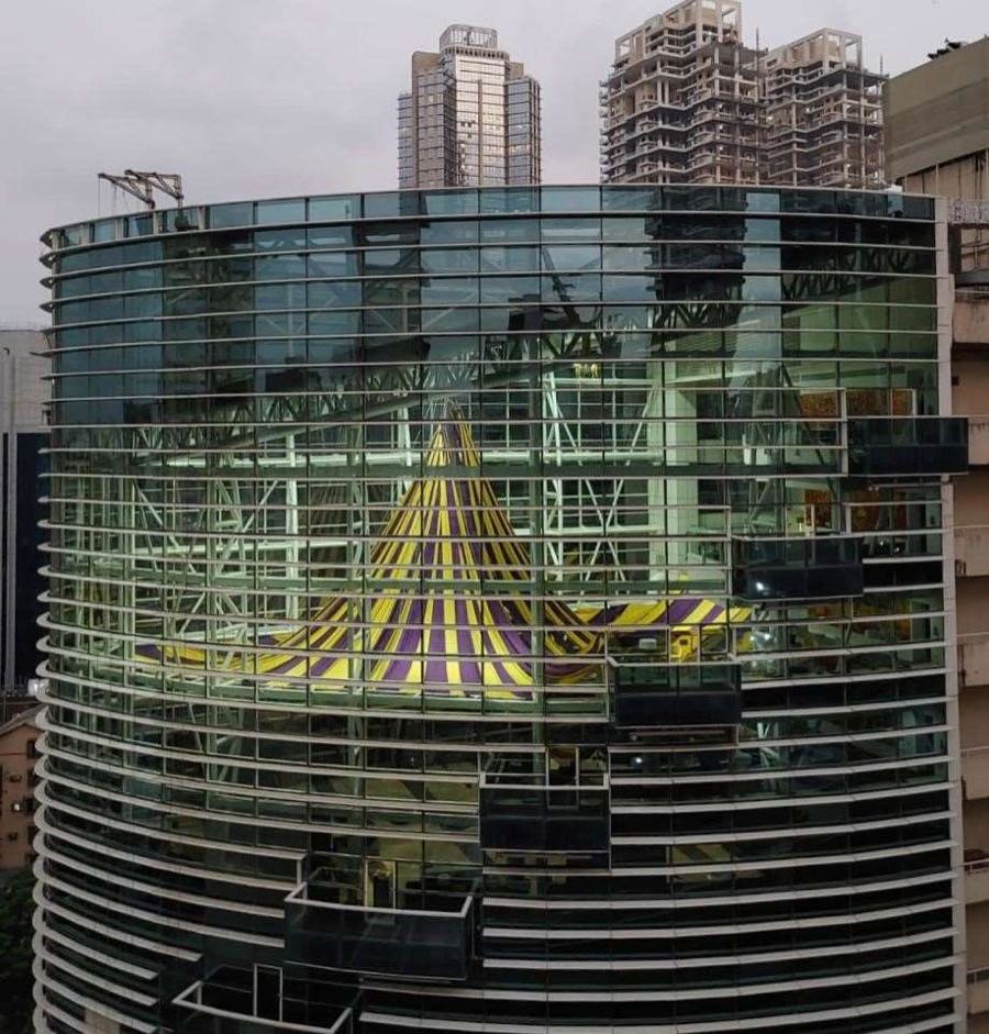 Curved glazed facade and steel atrium structure of Motilal Oswal Tower